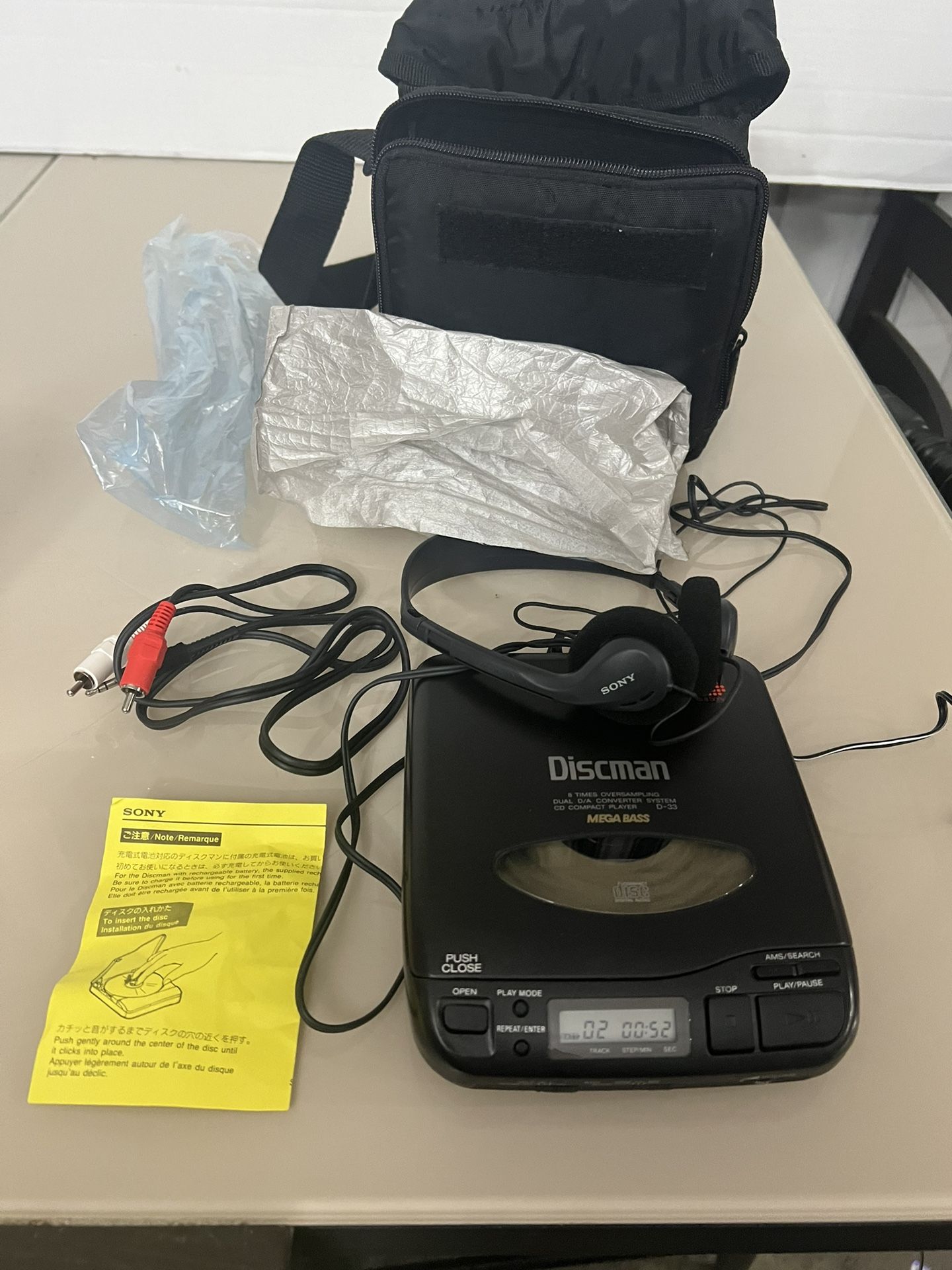 Sony Discman D-33 Portable CD Player comes with an AC-96NB Power Supply, a case, and more. It is a top-of-the-line CD player that allows you to listen