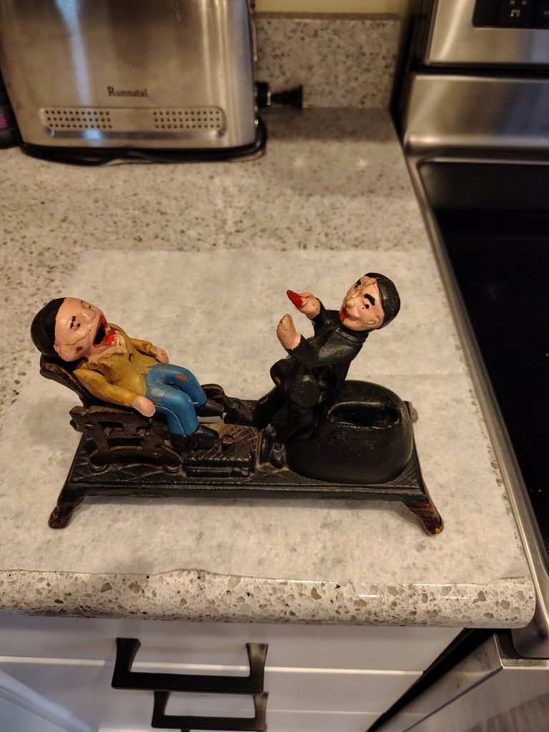 Cast Iron Mechanical Coin Bank Depicting a Dentist Pulling A Tooth