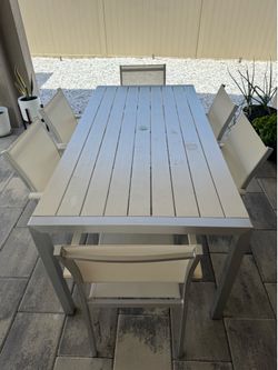 Outdoor dining table with 6 chairs
