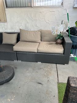. Rattan patio set with minor damage (shown in the photos); no Cushions