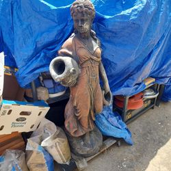 Woman holding two water jars fountain. Make offer.