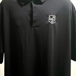 black Los Angeles Kings polo shirt, an officially licensed NHL product. These shirts are available from several brands, including Fanatics, lululemon,