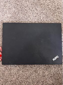 ThinkPad laptop with monitor connector and mouse