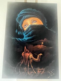 MIDDLE EASTERN MID CENTURY BLACK VELVET PAINTING OF BEDOUIN WOMEN AND CAMEL SIGNED AND FRAMED