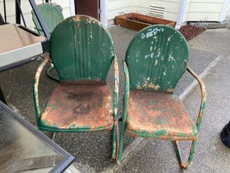 2 Mid century weathered metal patio chairs