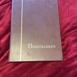 Large vintage worldwide stamp collection album (26 pages) featuring hundreds of stamps, including Germany, U.S., and international issues.