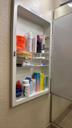 Medicine cabinet and bin full of assorted products