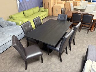 Black modern table with 6 leather chairs