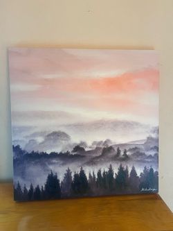 Canvas wall hanging of painted trees and sky.