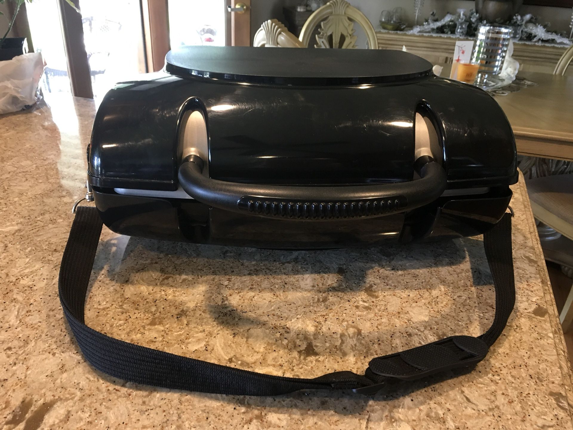 George Foreman portable gas grill. Great for camping or just on your patio. Comes with carrying case.