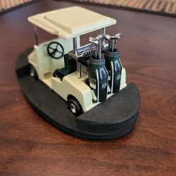 Relic Golf Cart With A Clock