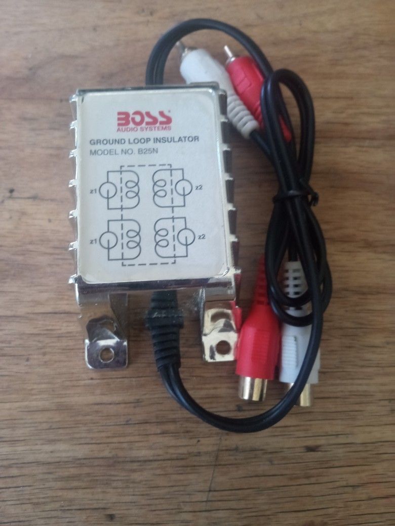 BOSS AUDIO SYSTEM GROUND. LOOP INSULATOR B25N NOISE FILTER FOR CAR AUDIO SYSTEMS