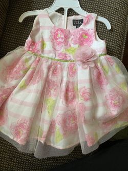 Brand new, size 12-18 months dress with diaper cover.