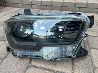 Toyota Tacoma OEM headlights