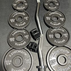 OLYMPIC CURLBAR AND WEIGHTS 