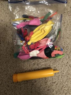 Full bag of balloons and pump