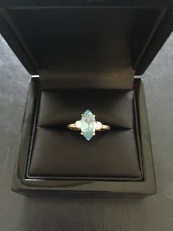 Custom-made sterling silver Blue Topaz and white sapphire ring