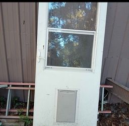 White Exterior Door with Window and Pet Door