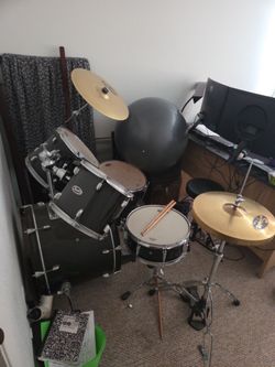 Squier Drumset with sticks and throne.