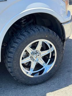Hostile H117 Venom 20x10 Chrome Rims 33x12.50R20 Mud Terrain Tires Wheels + Tires