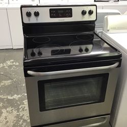 Frigidaire 4 Burner Glass Top Black And Stainless Steel Range. 1 year Warranty 