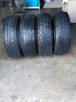 Almost new studded snow tires