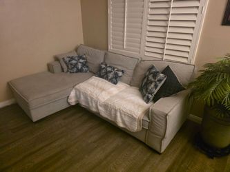 Playmax Gray 2-Piece Chaise Sectional with Pop-Up Sleeper from Bob's Discount Furniture.