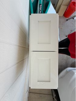 Two white shaker cabinets