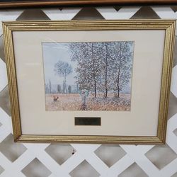 Framed print of the painting "Fields in Spring" (1887) by Claude Monet.