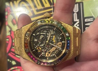 Frosted Skelton ap with rainbow bezel.