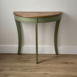 Stylish green half-moon console table