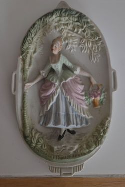 Vintage Bisque Porcelain Wall Plaque, Victorian lady with flower basket. 3‑D relief wall decor. Size: 7" long x 4" wide. Good condition, no chips.