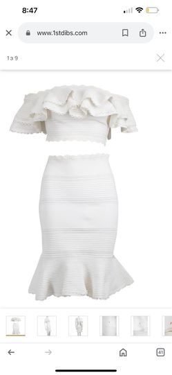 branded suit with ruffles. Alexander McQueen