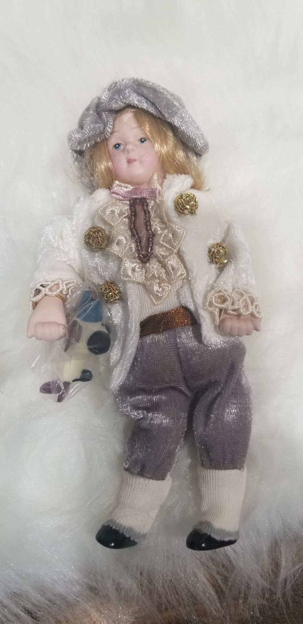 Porcelain Boy with Toy Airplane Collectible Christmas Ornament