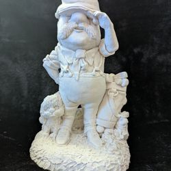 Figuring Statue Of Old Man Golfing With His Puppy