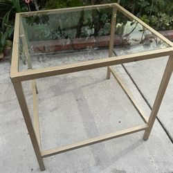 Coffee or side table with glass counter top, gold chrome frame and legs