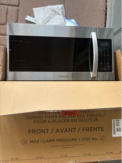 Samsung over the stove microwave brand new