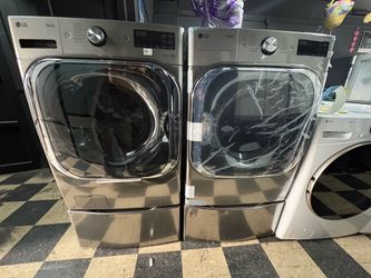 LG jumbo washer and dryer with pedestals