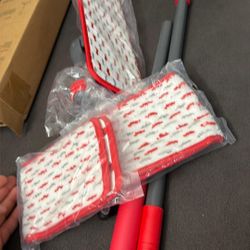 New flat mop. Has a red and black handle. Comes with two microfiber mop pads. Great for cleaning all floor types.