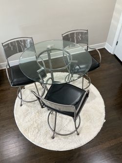 Dinette table and bar high stools stainless steel leather swivel chairs￼