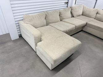 Cream sectional with chaise lounger