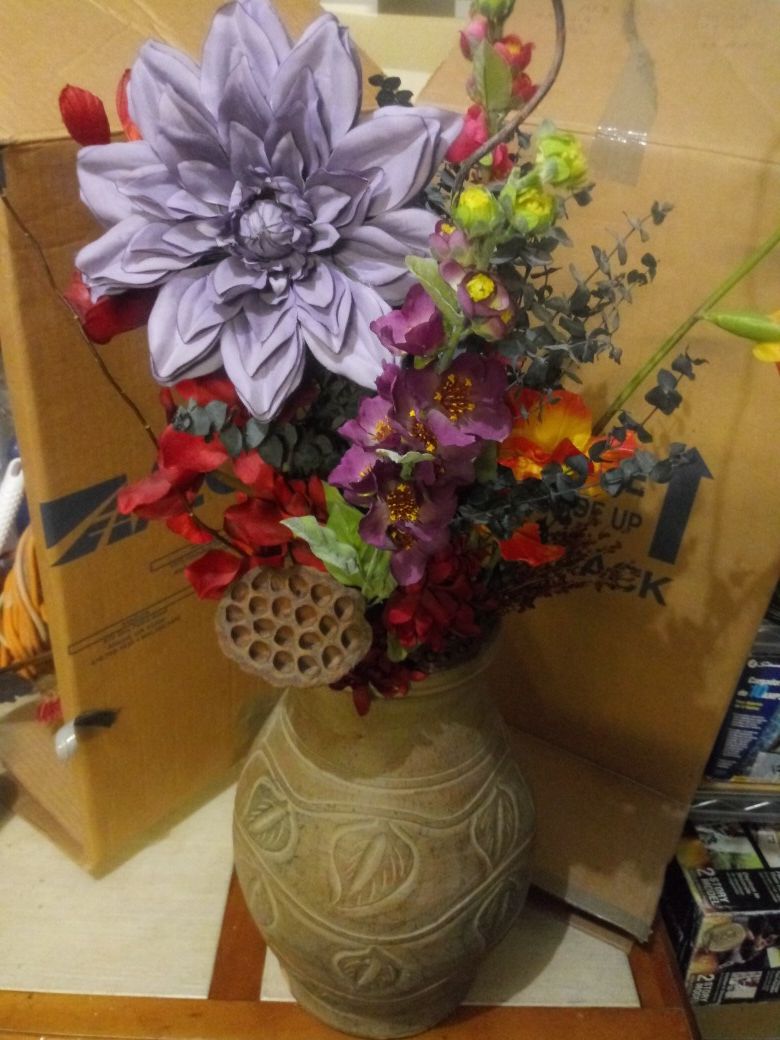 Terra cotta vase with flowers