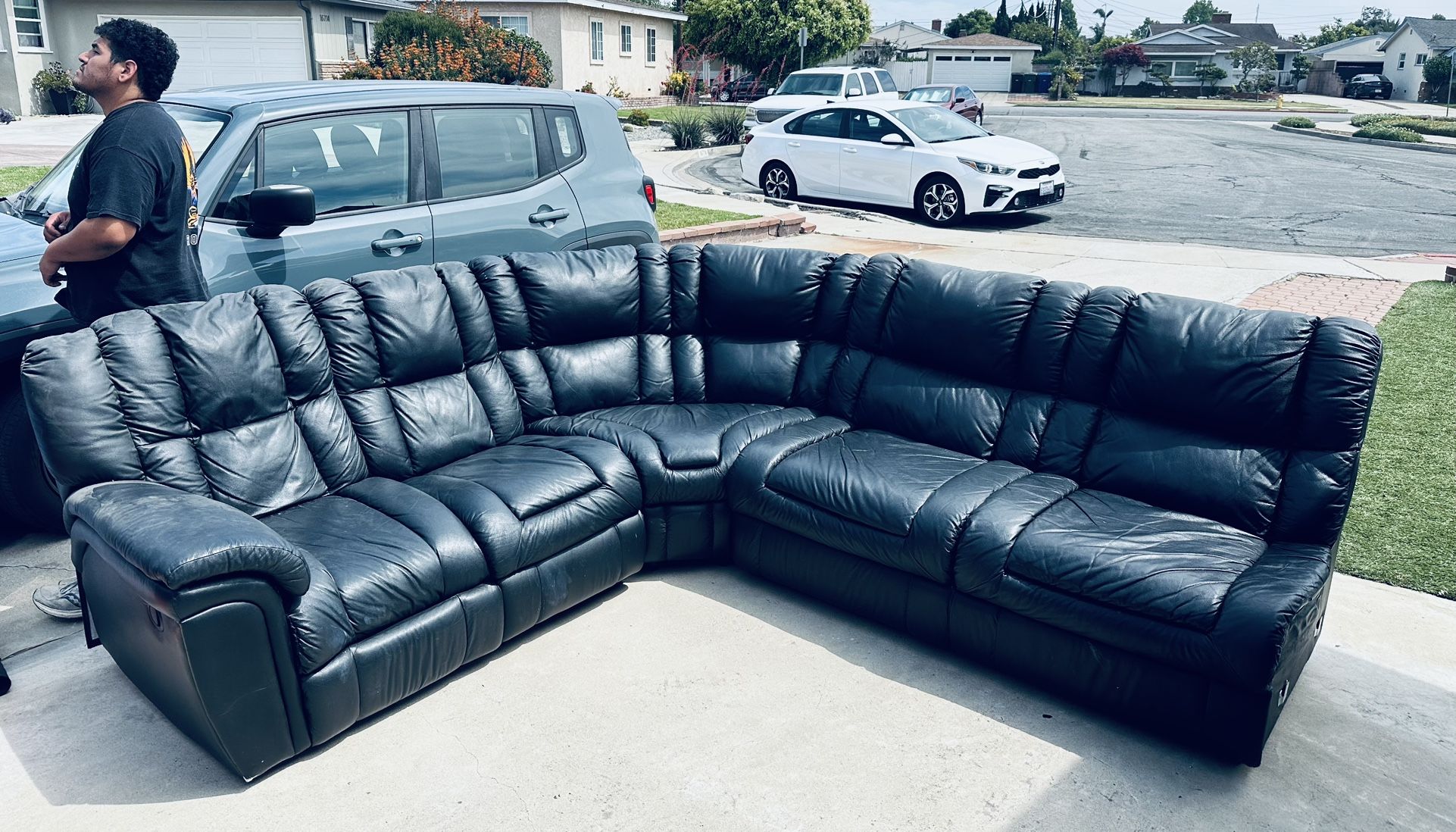 Black leather reclining sectional couch