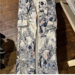NWT Rebel Vengeance Tapestry Cargo Jeans with a skull and floral pattern