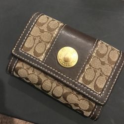 Vintage Coach Signature C canvas and brown leather snap wallet with a gold-tone 1941 medallion.