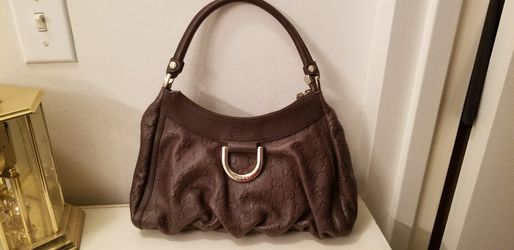 Brown Gucci hobo bag with tag