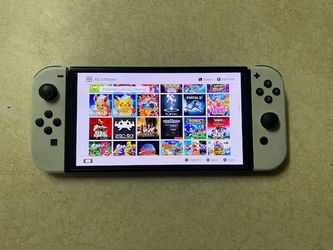NINTENDO SWITCH OLED MOD + 100 SWITCH GAMES and 7500 RETRO CLASSIC GAMES