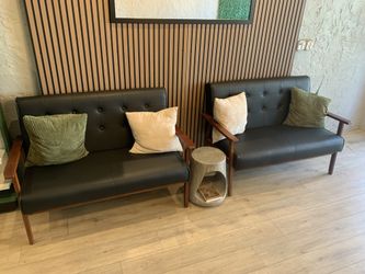 Pair of Black Loveseats With Accent Side Table