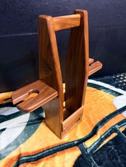This is a Handcrafted Wooden Wine Bottle and Glass Carrier.