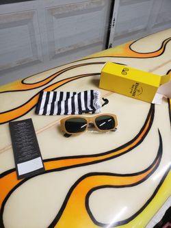 Sunglasses surfboards skateboards